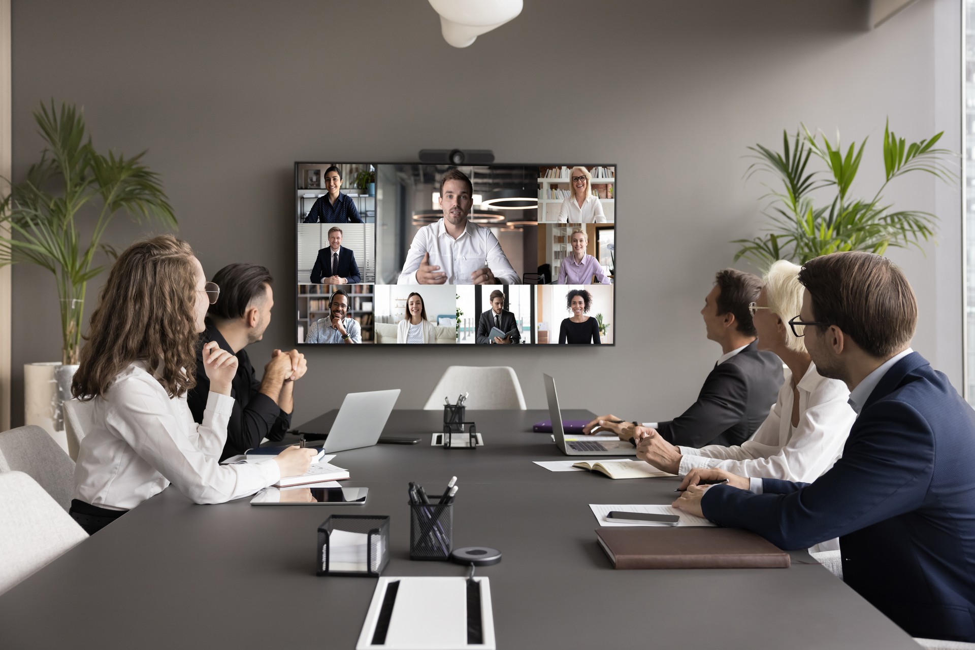 Office employees and freelancers meeting on online video chat